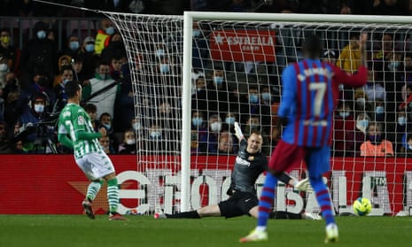 Betis’ Juanmi (left) slots the ball past Barcelona’s goalkeeper Marc-Andre ter Stegen.