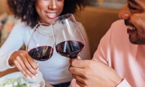 Happy Romantic Couple Toasting With Wineglasses In Cafe