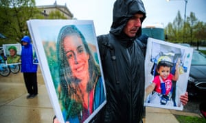 Protesters gather outside the Field Museum holding photographs of people who died in the Ethiopian Airlines and Lion Air crashes.
