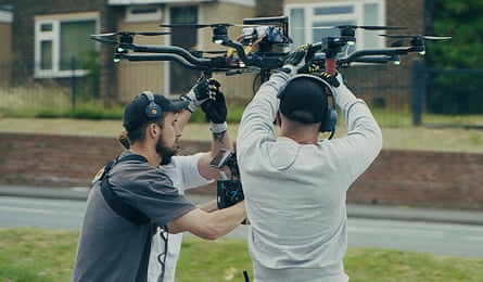 Two of the crew with the drone used in the shot