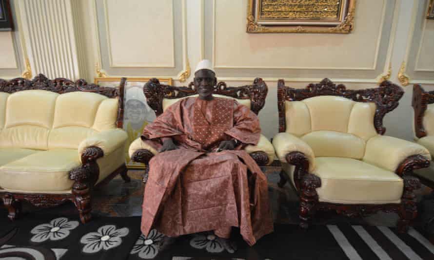 Chérif Haidara sits in his palatial reception room on the fourth floor of his home in Bamako.