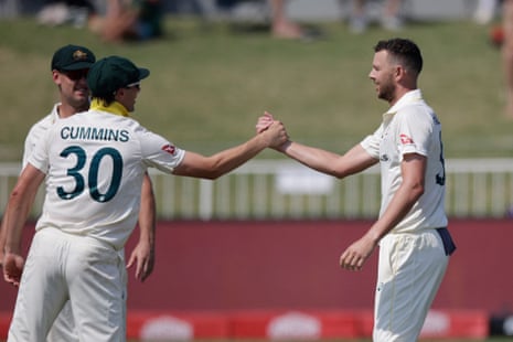 Hazlewood celebrates with Cummins after the dismissal of Jansen.