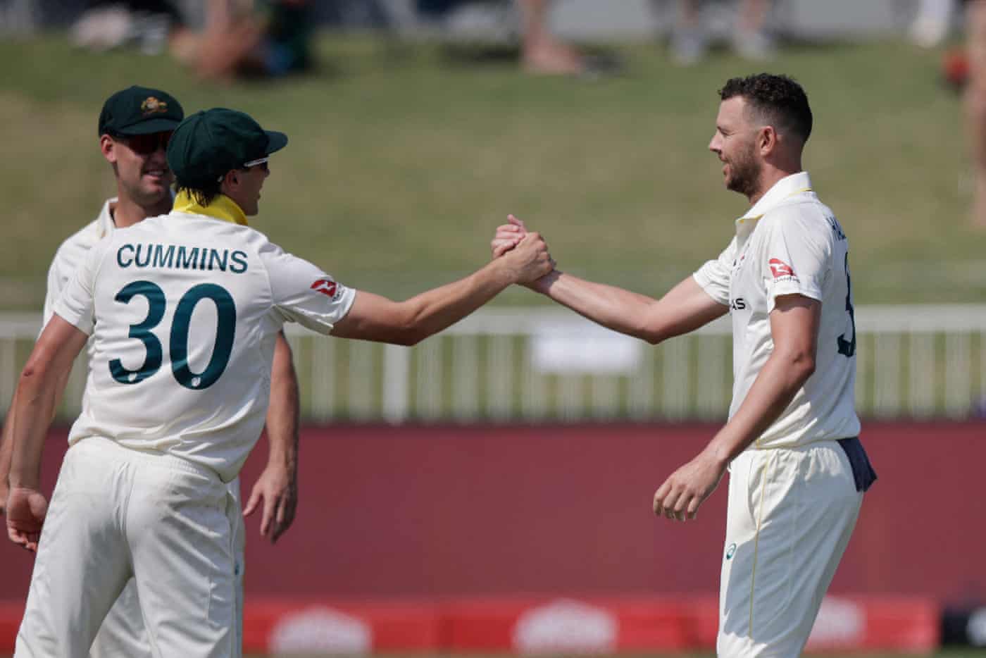 Hazlewood celebrates with Cummins after the dismissal of Jansen.