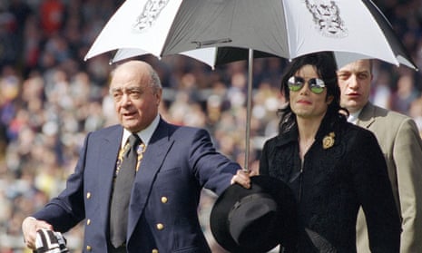 Michael Jackson with Mohamed Al Fayed on a lap of honour at Craven Cottage in April 1999.