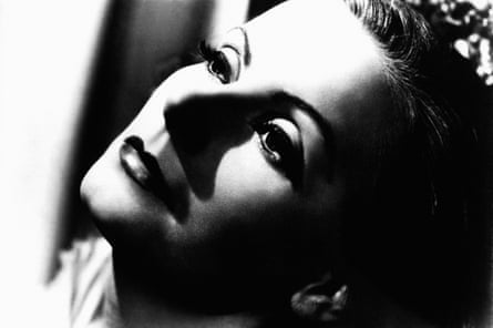A close-up of a woman’s face with skinny eyebrows