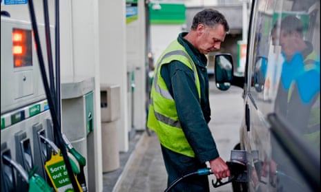 A man fills his van up at a petrol pump
