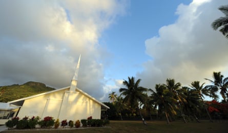 A church surrounded by palm trees