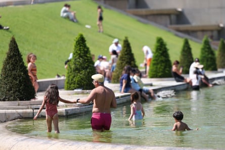 people bathing in a fountain
