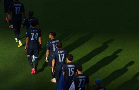 Uruguay players walk out before the start of the match