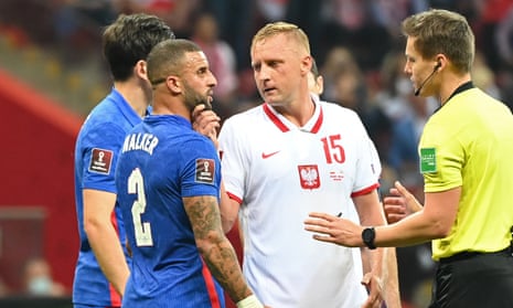 Kamil Glik clashes with Kyle Walker during England’s 1-1 draw in Poland on Wednesday.