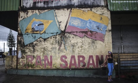 A Venezuelan woman is seen in a street in the border city of Pacaraima, Brazil.