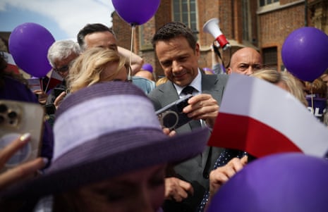 Civic Coalition presidential candidate, Warsaw Mayor Rafal Trzaskowski takes a selfie with supporters during an election meeting in Brzeg, Poland.