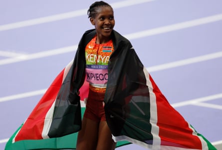 Faith Kipyegon celebrates winning 1500m gold at the Paris 2024 Olympics.