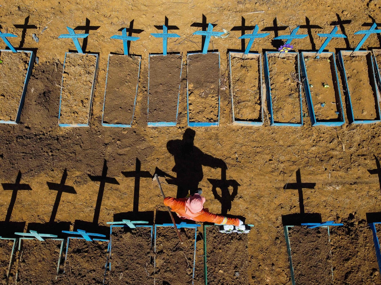 A gravedigger stands at the Nossa Senhora Aparecida cemetery in Taruma, Manaus, where Covid-19 victims are buried daily, on 2 June.