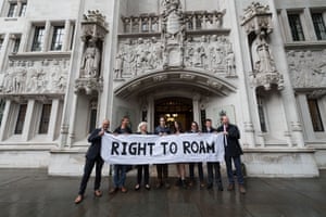 A small group of people holding a ‘right to roam’ banner outside the UK supreme court
