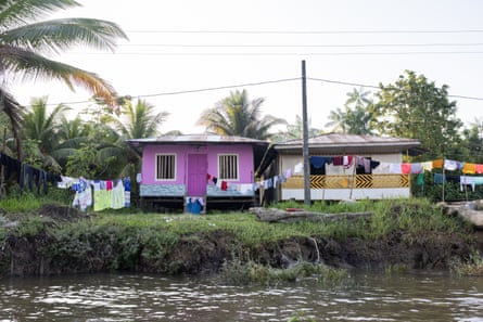 A pink house by the water, belonging to Cristina Aragón, a fish vendor