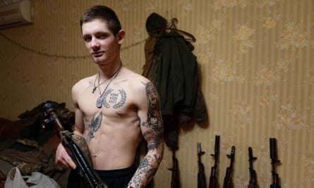 A soldier holds a gun