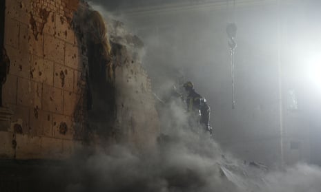 Rescuers work at the site of a residential building damaged by a Russian missile in Kryvyi Rih.