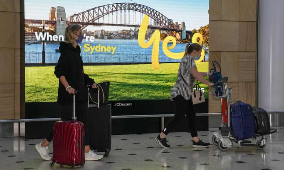 Passengers arrive at Sydney airport on Monday