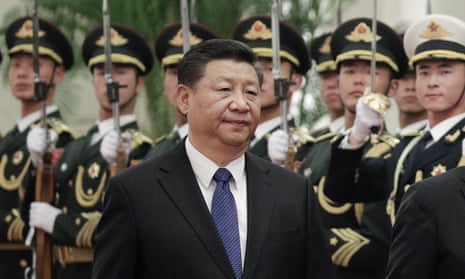 Chinese President Xi Jinping in front of troops standing to attention