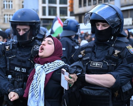 Riot police take a demonstrator away during a pro-Palestinian rally in Frankfurt in 2023.