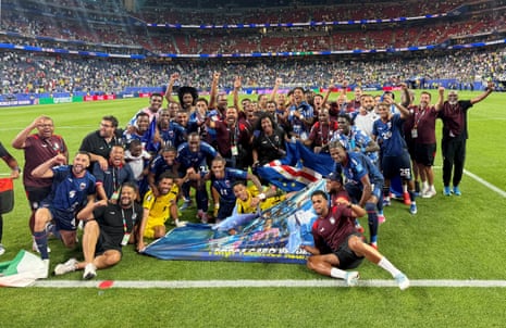 Cape Verde players and staff celebrate after the match as Cape Verde qualify for the knockout stages of the World Cup