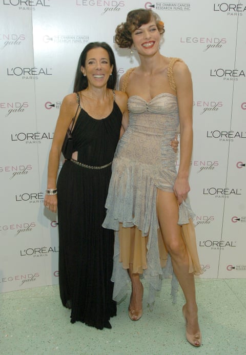 Kates and Jovovich posing with their arms around each other for the cameras