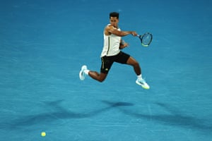 Michael Mmoh flings a forehand to Rafael Nadal.