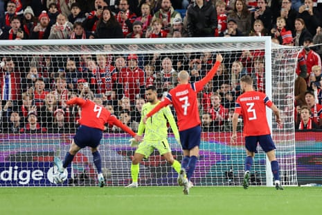 Erling Haaland of Norway scores his team’s first goal past Diogo Costa of Portugal.