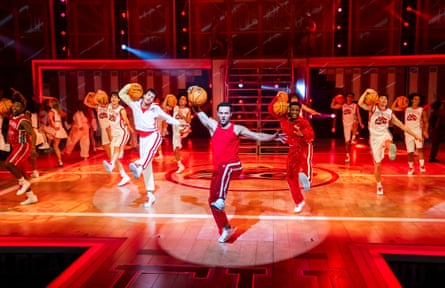 Harry Judd leads a group of dancers, each with a basketball