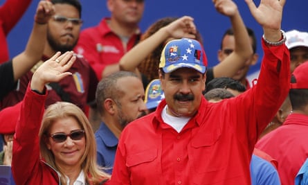 Nicolás Maduro and the first lady, Cilia Flores, acknowledge supporters at the end of a rally in Caracas on Saturday.