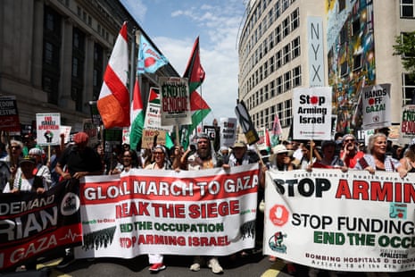 Pro-Palestinian demonstrators march through central London calling for the UK government to stop allowing arms exports and military cooperation with Israel, on Saturday.