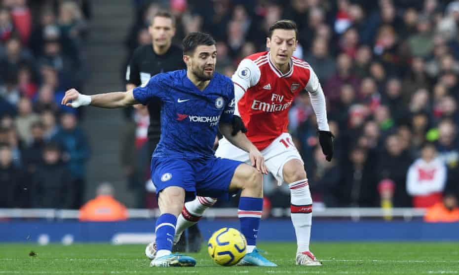 The back-in-favour Mesut Özil  challenges Mateo Kovacic