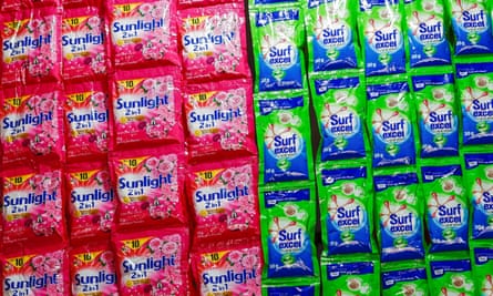 Brightly coloured sachets of Sunlight and Surf detergent.