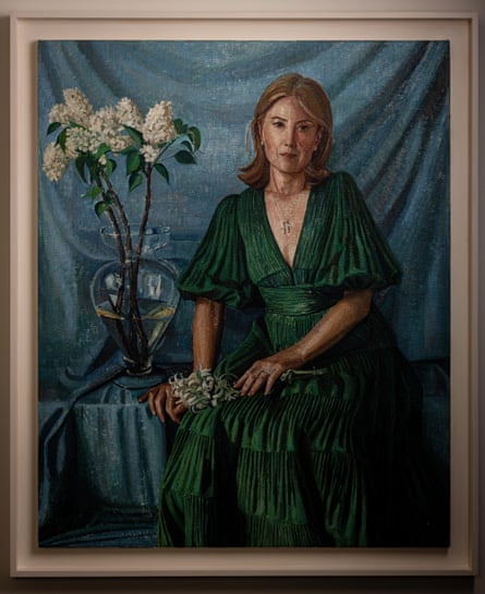 Painting of woman in a green dress, sitting next to a vase of white flowers