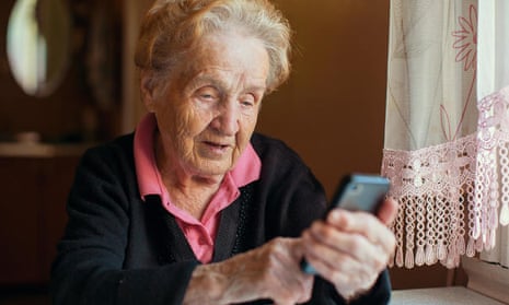 A woman uses a smartphone