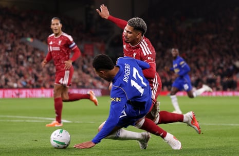 Morgan Rogers is bundled over in the Liverpool box by Ronald Araujo.
