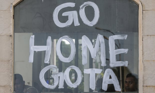The words ‘Go home Gota’ painted on a window.