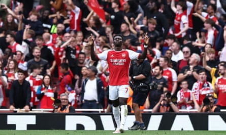 Bukayo Saka celebrates after forcing Cristian Romero to turn the ball into his own net