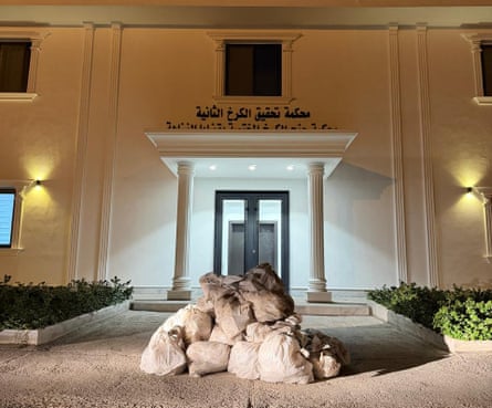 Sacks of cash outside a state building in Iraq