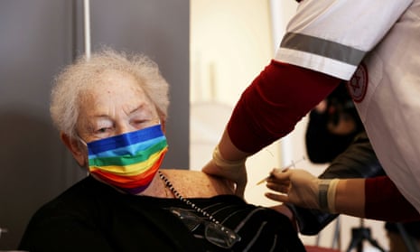 An Israeli woman receives a Covid vaccine booster shot in Netanya