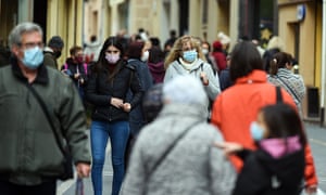 People wear face masks as a precaution against the spread of Covid-19 in Vendrell, Spain.