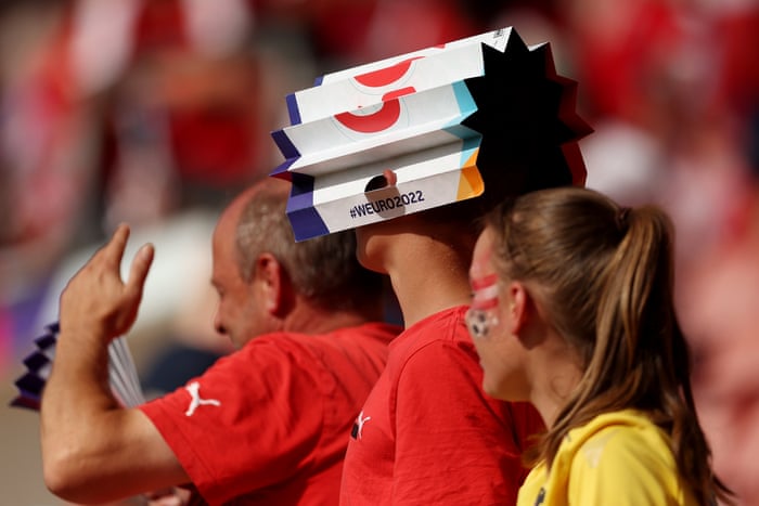 An Austrian fan tries to escape the heat.