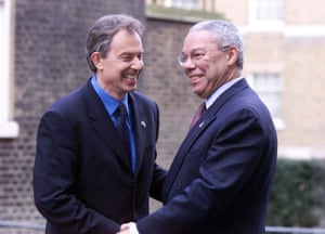 The then prime minister, Tony Blair, greets Powell outside 10 Downing Street in 2001