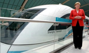 German Chancellor Angela Merkel stands in front of a Transrapid train in Shanghai, China, Tuesday, 23 May 2006. Merkel rode the world s first commercial maglev Transrapid train to the Shanghai airport Tuesday to catch her flight back to Berlin.
