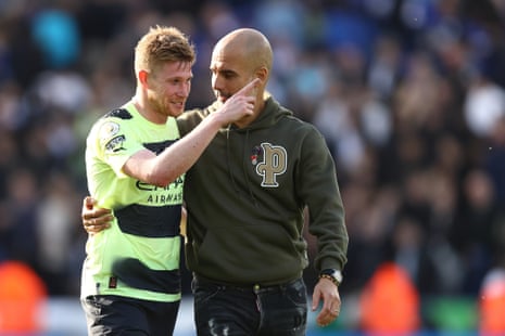 Goalscorer Kevin De Bruyne and Manchester City boss Pep Guardiola celebrate their victory after the final whistle.