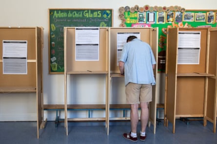 A voter prepares his ballot paper at the Marlborough Street National School polling station in Dublin.