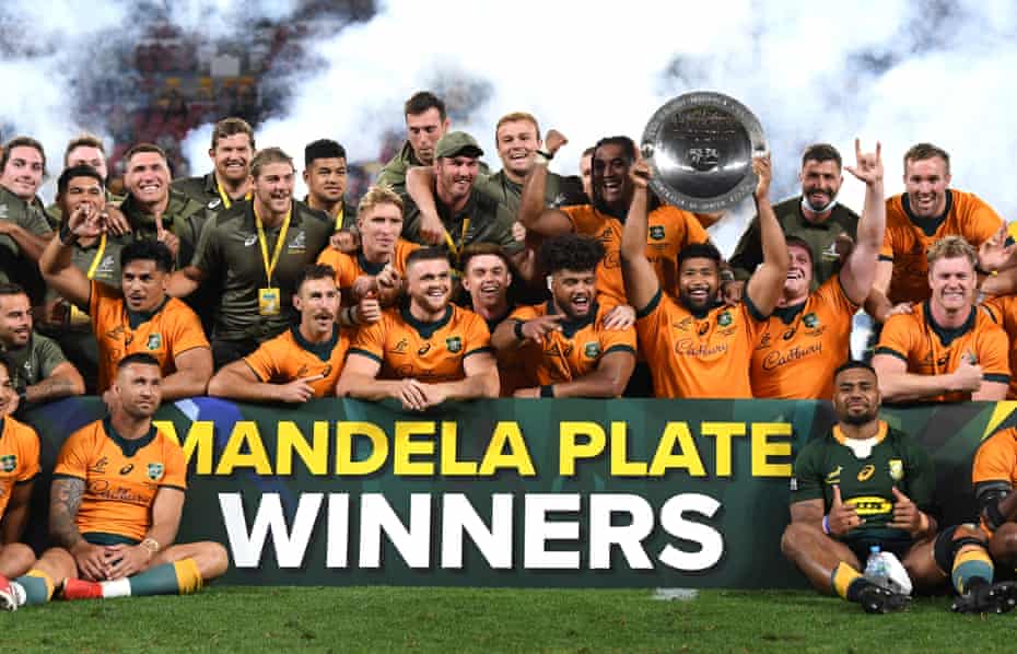 Wallabies players celebrate winning the Mandela Plate.