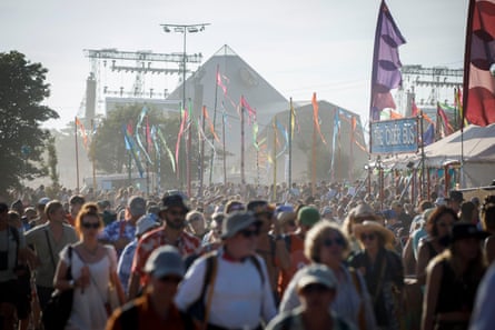 Festivalgoers leave the Pyramid stage after Chic.
