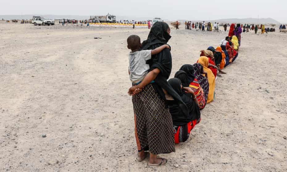 Displaced women and children queue for food at the Silsa internally displaced peoples’ camp in Ethiopia.